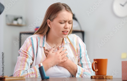 Young woman having asthma a...