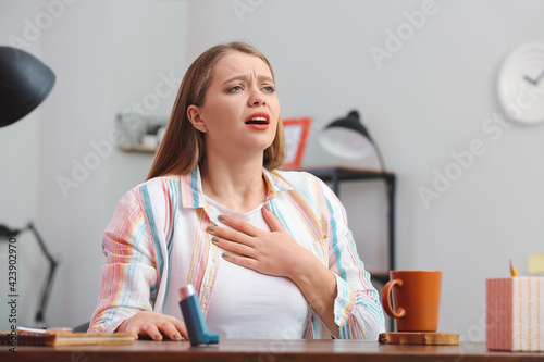 Young woman having asthma a...