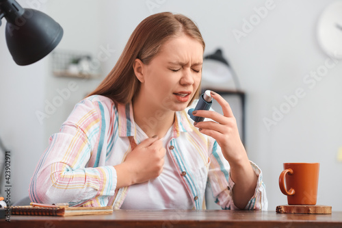 Young woman with inhaler ha...