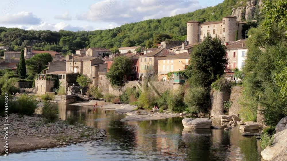 Ardeche river and old village of Vogüé in the south of France Ardeche river and old village of Vogüé in the south of France