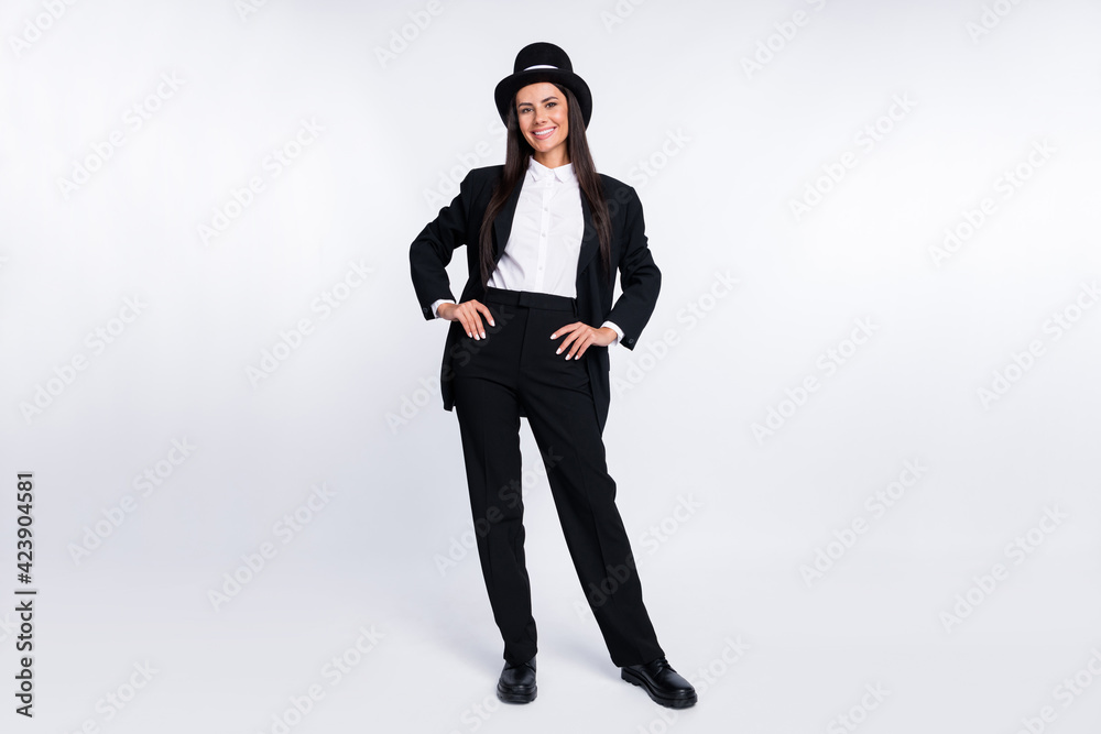 Full size photo of young beautiful happy smiling confident woman magician sorcerer isolated on white color background Full size photo of young beautiful happy smiling confident woman magician sorcerer isolated on white color background