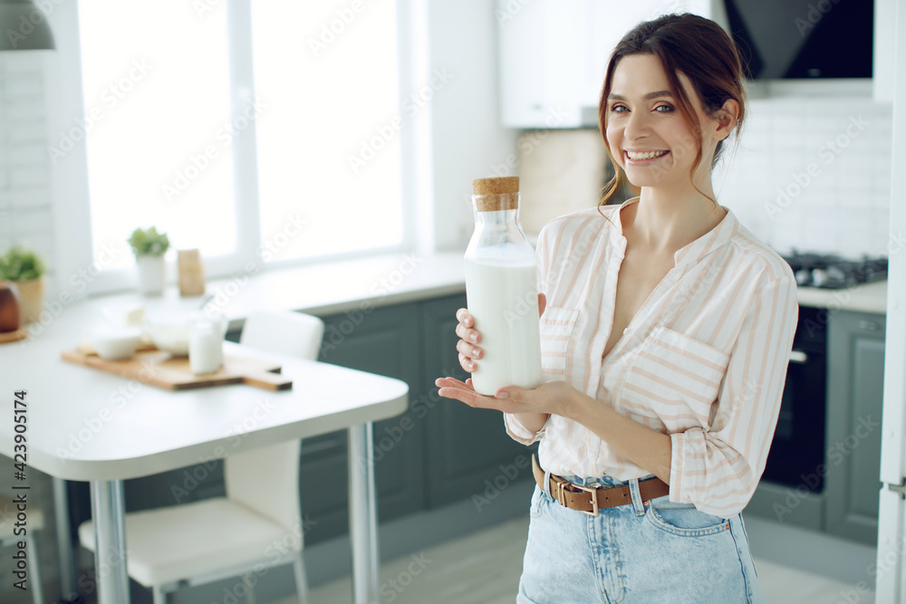 Woman food. Young woman in the kitchen at home. High quality photo. Woman food. Young woman in the kitchen at home. High quality photo.