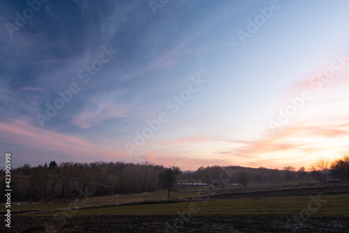 Rural landscape. Sunset over the field in spring