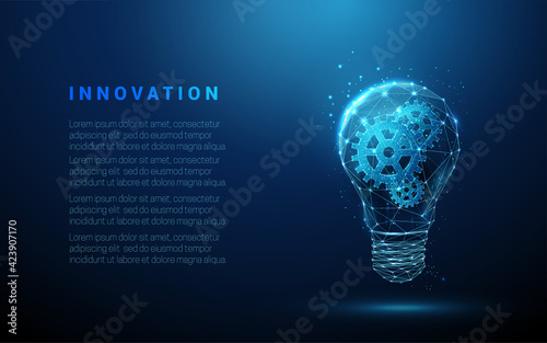Abstract blue glowing light bulb with gears inside. Artificial intelligence and machine learning concept. photo