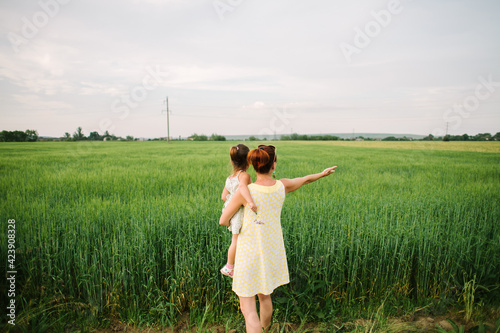 mom and daughter in the field. summertime.