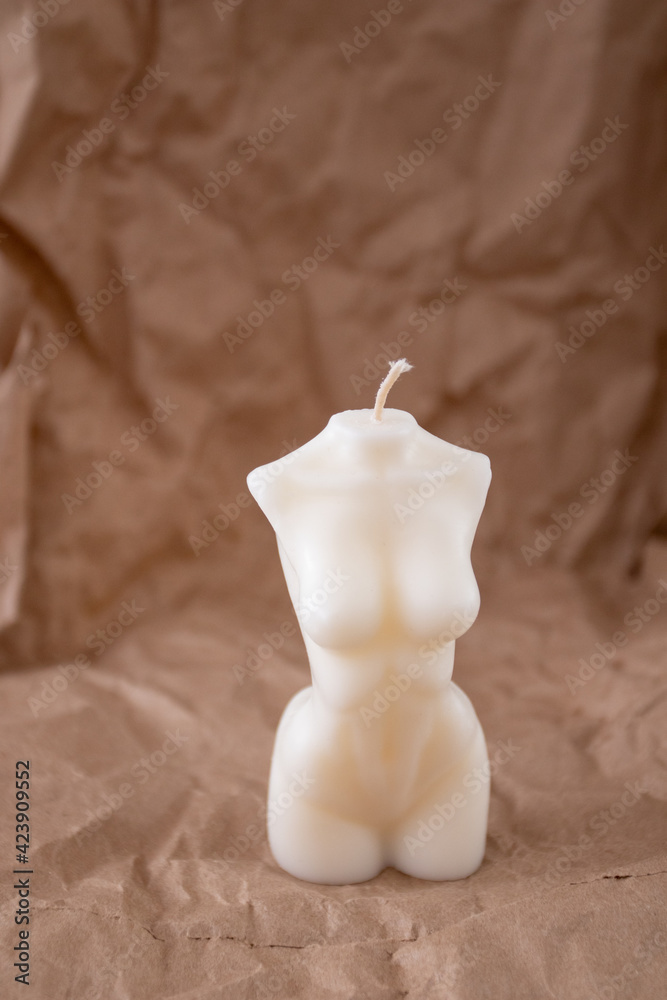 Scented Woman torso candle. Aroma candle in the form of a female shape. Vertical shot Scented Woman torso candle. Aroma candle in the form of a female shape. Vertical shot