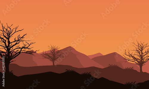 Fantastic silhouette of mountains and dry trees at dusk from the suburbs. Vector illustration