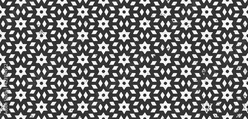 Seamless repeating pattern in boho style on dark background. Dirty grunge texture with star shape. Vector template. Ethnic monochrome wallpaper. Abstract geometric backdrop. Vintage decorative print