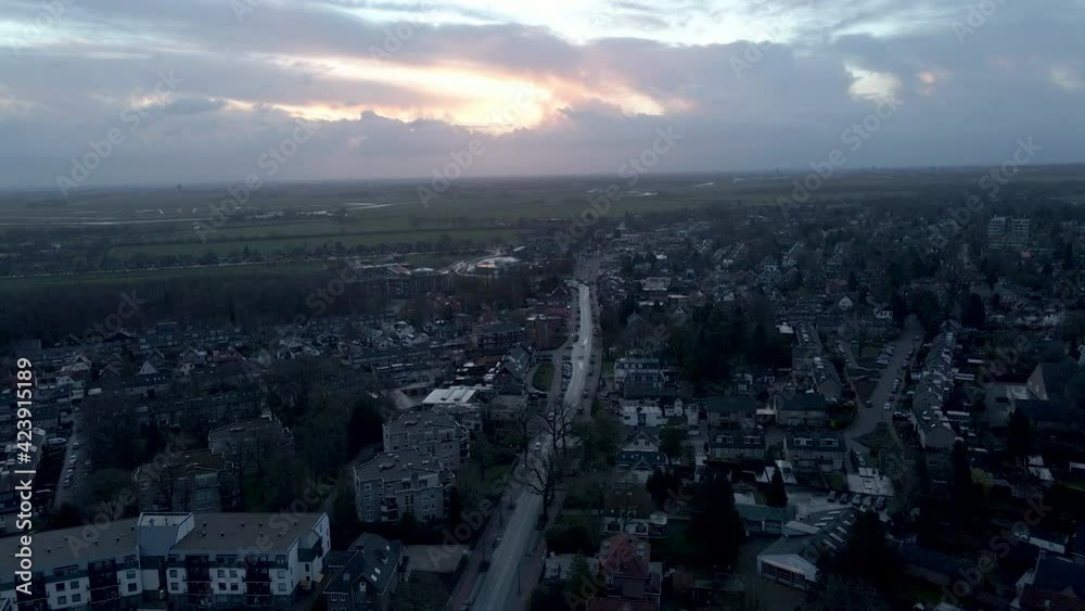 Aerial of calm street in small Dutch town at sunrise Aerial of calm street in small Dutch town at sunrise