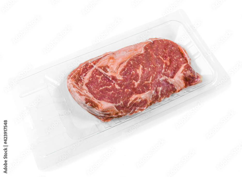 Marbled beef steak. Vacuum packed. View from above. White background. Isolated. Marbled beef steak. Vacuum packed. View from above. White background. Isolated.