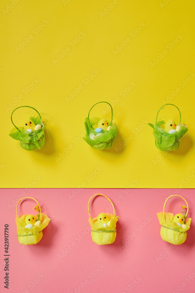 Easter eggs on the yellow -pink background. Happy Easter. Holiday concept. Focus on chicken on yellow background. Easter eggs on the yellow -pink background. Happy Easter. Holiday concept. Focus on chicken on yellow background.