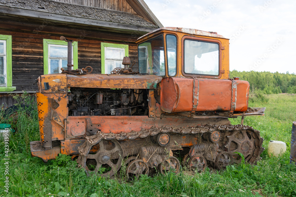 Old crawler tractor bulldozer. Bulldozer T-130 Tracked tractor platform T-130. 