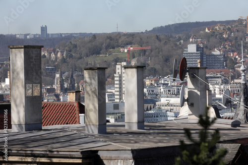 schornsteine und satellitenanlage auf einem dach in stuttgart photo