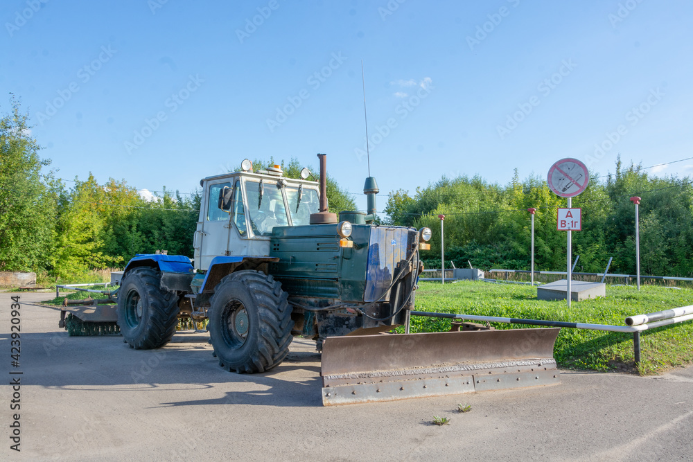 Wheeled tractor bulldozer with a blade. Wheeled tractor bulldozer with a blade.