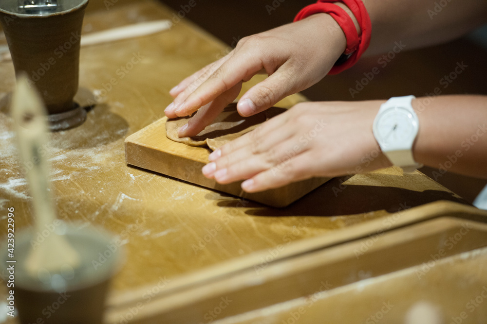 Chef woman hands making pasta. Cooking process. Raw food photography concept Chef woman hands making pasta. Cooking process. Raw food photography concept