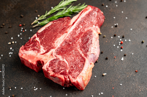 raw T-Bone Beef Steak on stone background