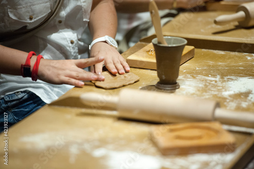 Chef woman hands making pasta. Cooking process. Raw food photography concept