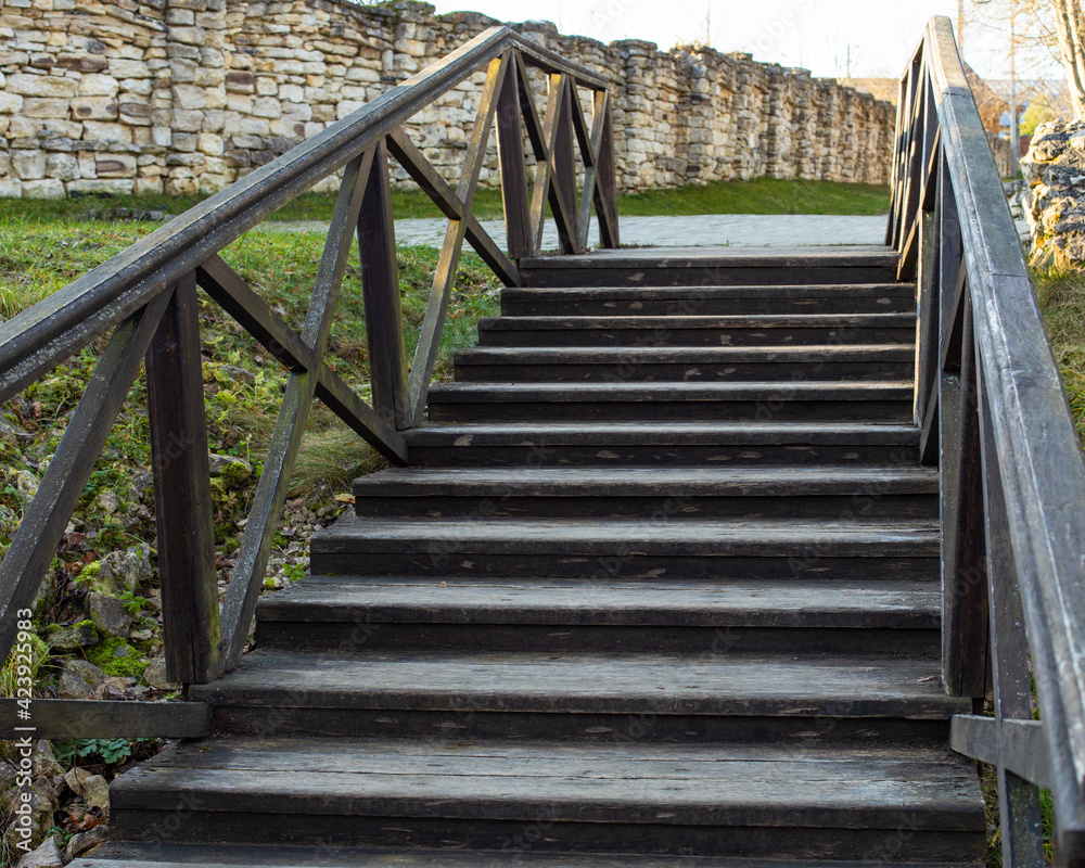 Old wooden staircase with railing, rustic staircase with steps, background design