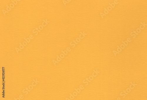 Yellow coloured creative uncoated paper background. Extra large highly detailed image.