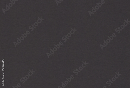 Black coloured creative uncoated paper background. Extra large highly detailed image.