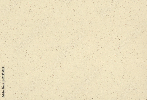 Recycled beige, light yellow paper background with inclusions of small natural fibers. Extra large highly detailed image.