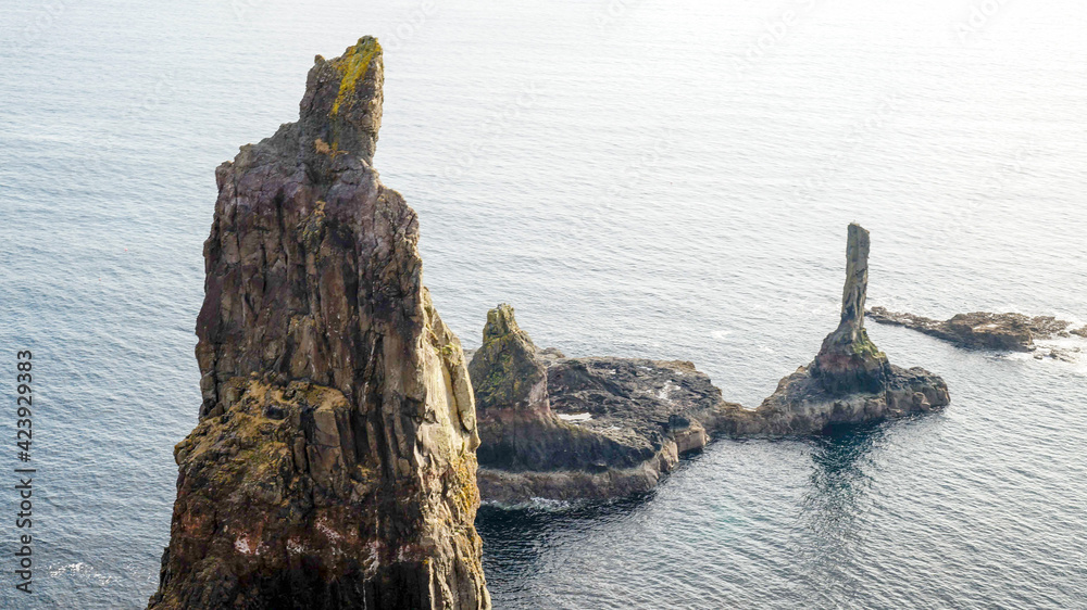 Three Maidens rock formations at the ocean on Isle of Skye in northern Scotland.