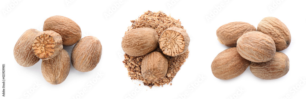 Set with nutmeg seeds on white background, top view. Banner design Set with nutmeg seeds on white background, top view. Banner design