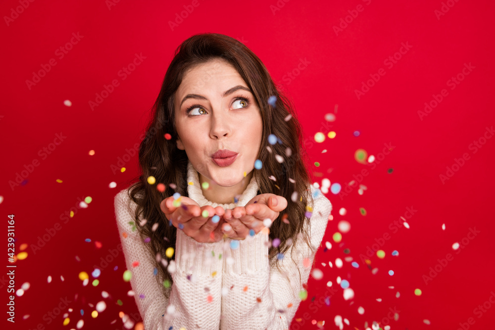 Photo of adorable dreamy young lady wear collar pullover blowing arms glitter looking empty space isolated red color background Photo of adorable dreamy young lady wear collar pullover blowing arms glitter looking empty space isolated red color background