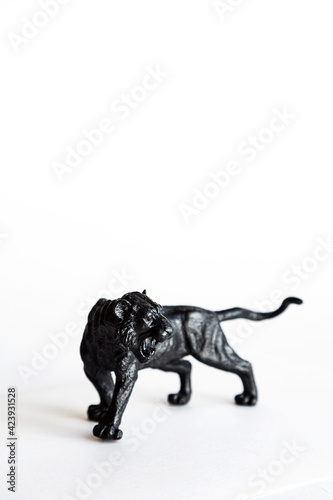 Black tiger toy isolated on white background.