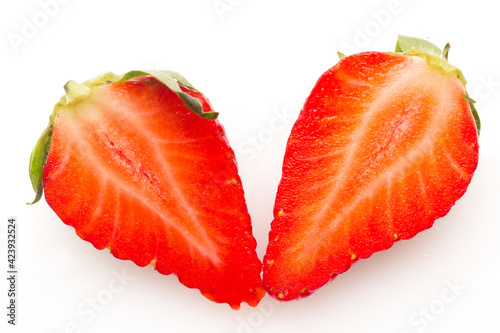 Two strawberries close up on white background