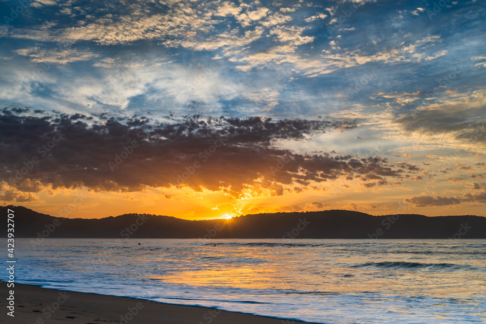 Fototapeta premium Sunrise seascape at the beach with haze and cloud