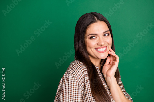 Photo of dreamy flirty lady finger cheek look empty space wear checkered shirt isolated green color background