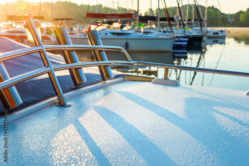 Fototapeta Naklejka Na Ścianę i Meble -  close up view of motor boat bow with morning dew in sunlight