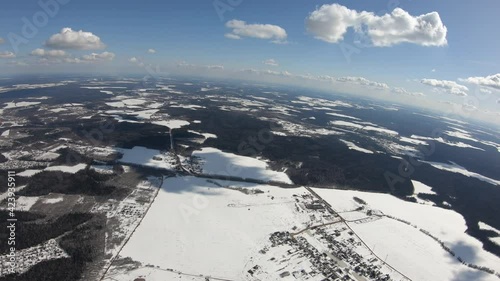 Flight above white landscape. Winter season.