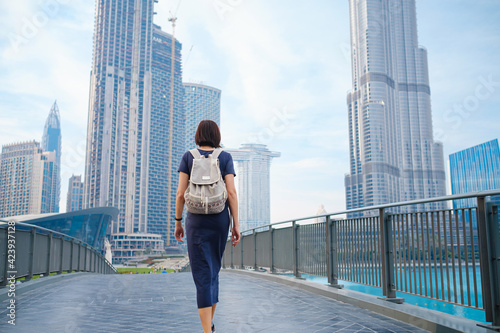 Young beautiful woman enjoying the view of Dubai downtown.