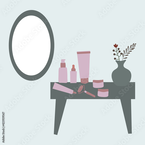 Cosmetics,skincare and a mirror on the dressing table.