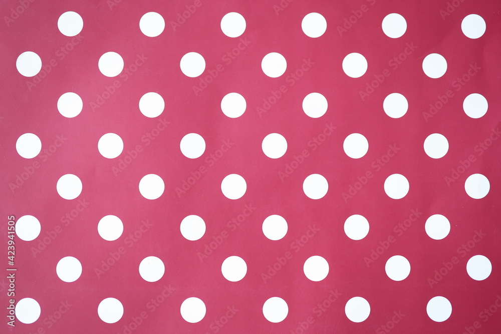 Red background with white circles. Polka dot closeup Red background with white circles. Polka dot closeup