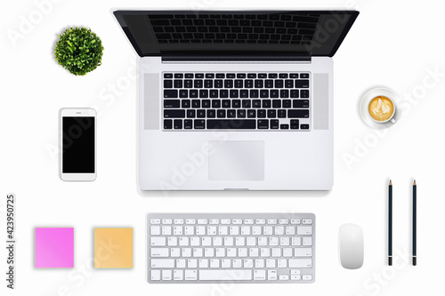 Modern workplace with copy space for laptop and smartphone on white table background. View from above.