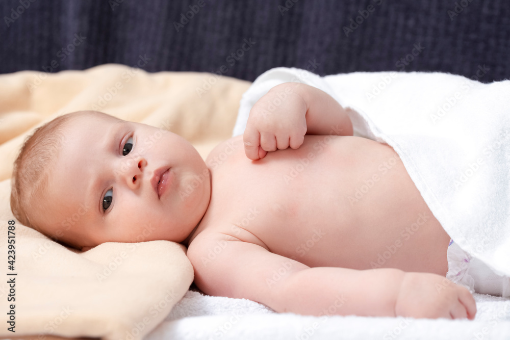 Closeup image of Cute Newborn Baby Boy On White Blanket. Closeup image of Cute Newborn Baby Boy On White Blanket.