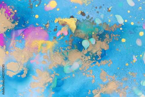art photography of abstract fluid art painting with alcohol ink  blue  pink and gold colors