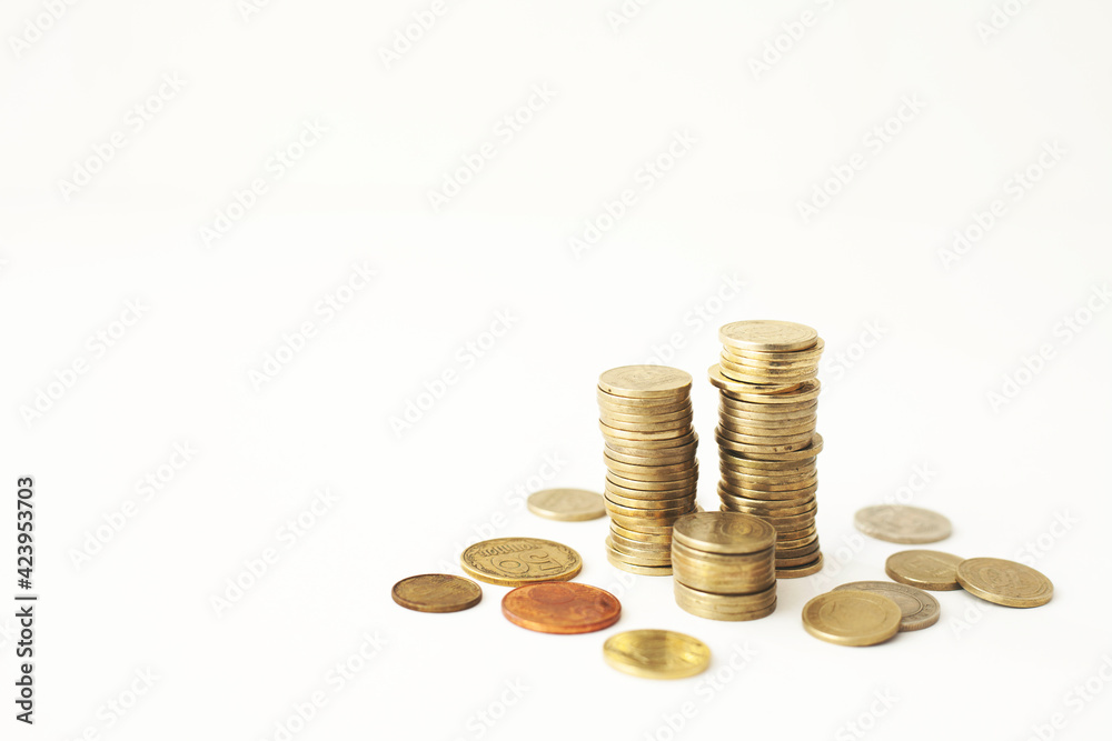 Mixed coin stacks on a white background Mixed coin stacks on a white background