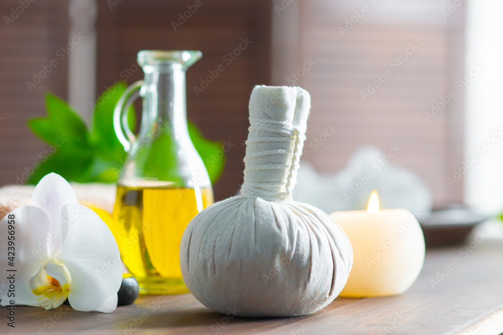 Spa background. Towel, candles, orchid flowers and herbal balls. Massage, oriental therapy, wellbeing and meditation. Spa background. Towel, candles, orchid flowers and herbal balls. Massage, oriental therapy, wellbeing and meditation.