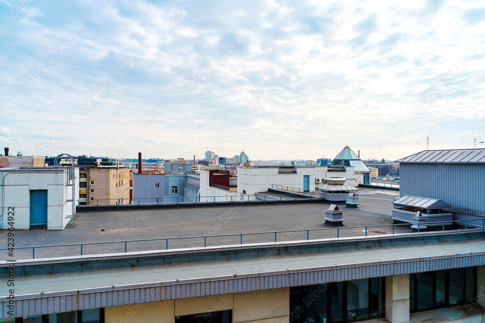 Roofs of St. Petersburg in an industrial and residential area. St Petersburg, Russia - 28 Mar 2021