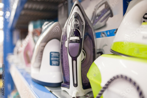Irons on display in home appliance store