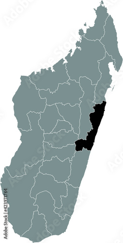 Black highlighted location map of the Malagasy Atsinanana region inside gray map of the Republic of Madagascar photo