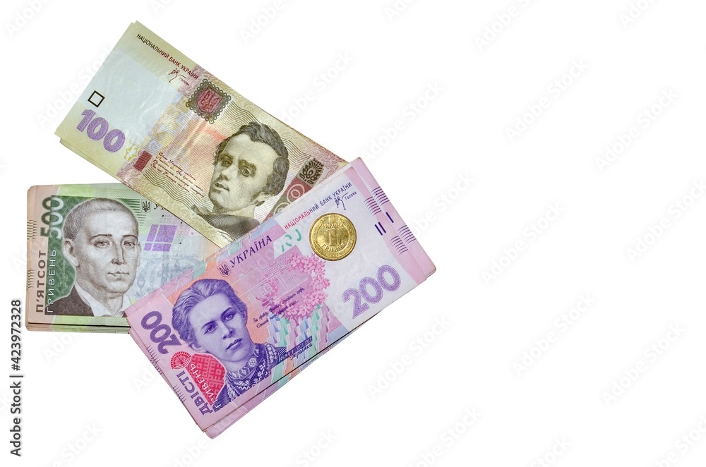 Modern ukrainian money - hryvnia. Stack of 500, 200, 100 banknotes and one coint (kopijka) Flat lay, top view. Isolated on white background with free space for your text. Money and financial concept Modern ukrainian money - hryvnia. Stack of 500, 200, 100 banknotes and one coint (kopijka) Flat lay, top view. Isolated on white background with free space for your text. Money and financial concept