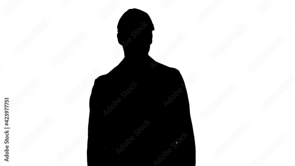 Silhouette Fashionable businessman in a suit walking slowly. Silhouette Fashionable businessman in a suit walking slowly.
