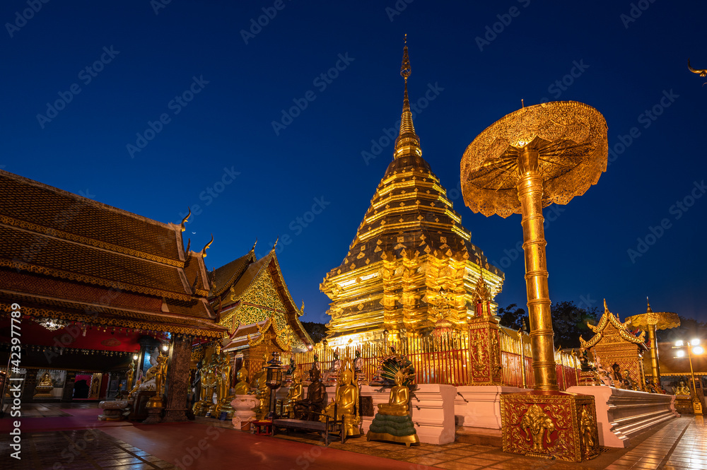 Fototapeta premium Wat Phra That Doi Suthep with light up at dusk, the most famous temple in Chiang Mai, Thailand