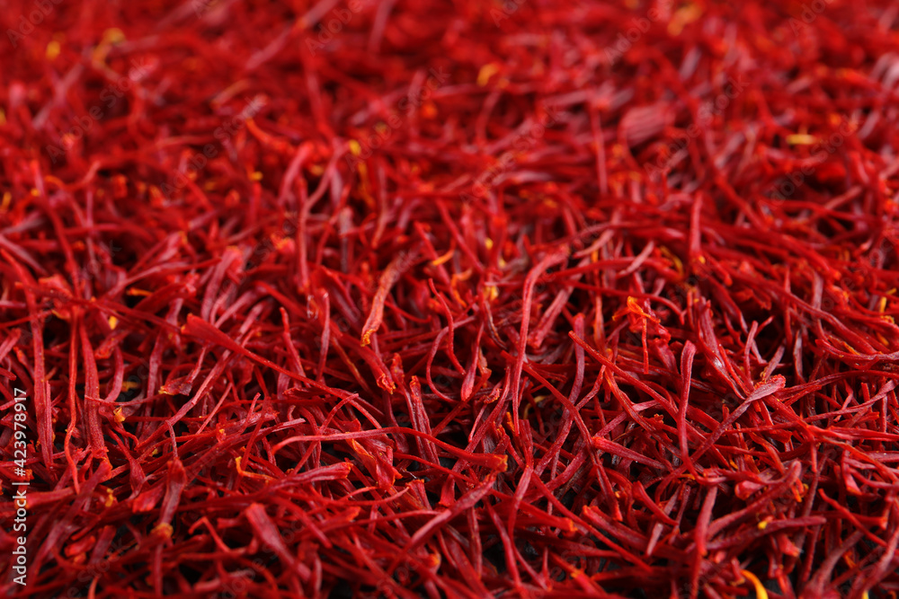 Fototapeta premium Aromatic dried saffron as background, closeup view