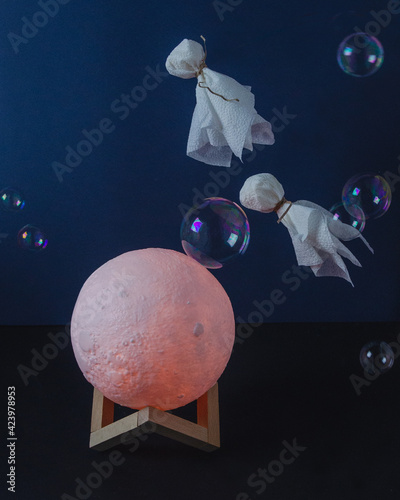 flying ghosts in soap bubbles over the moon photo